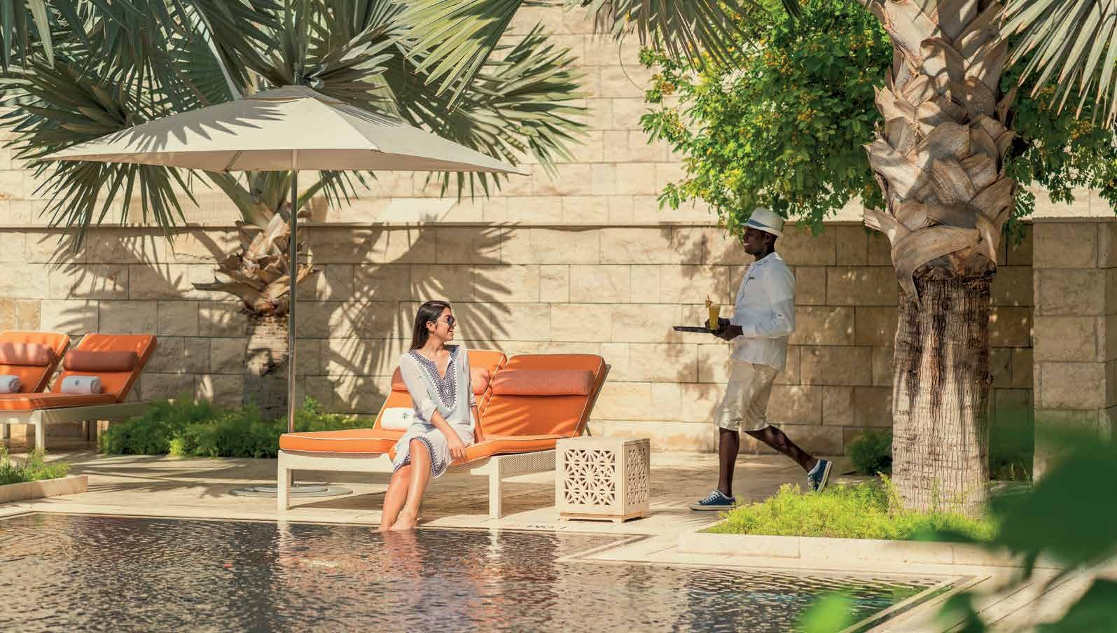 Family poolside at a Bahrain resort