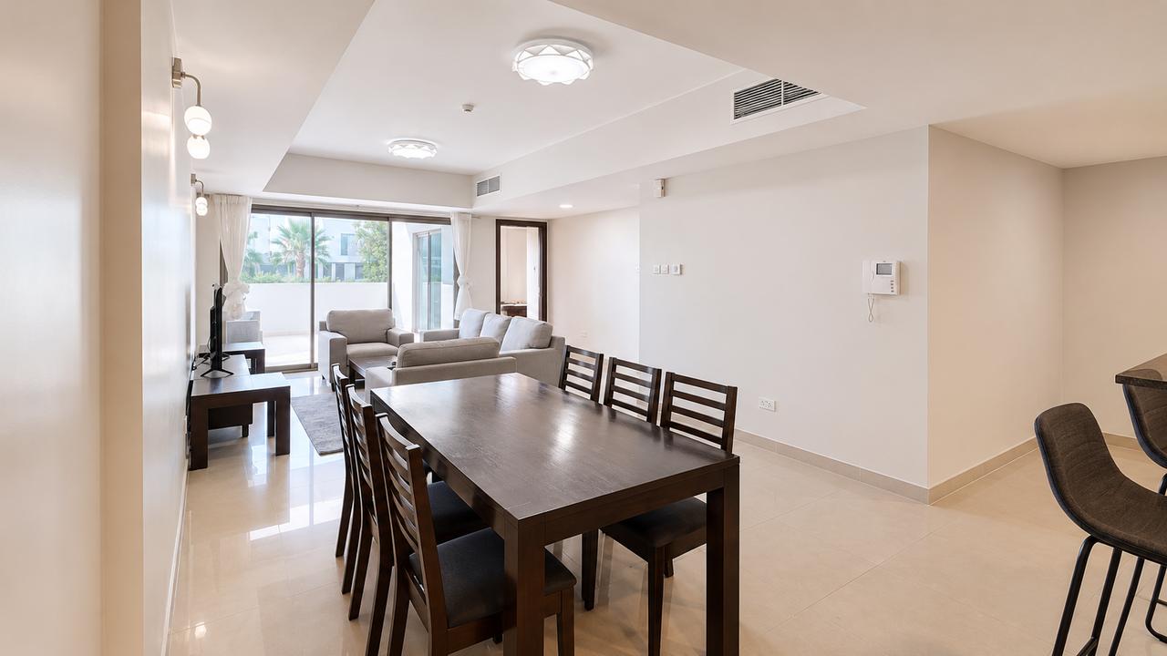 Two-Bedroom Apartment with Private Garden and Pool