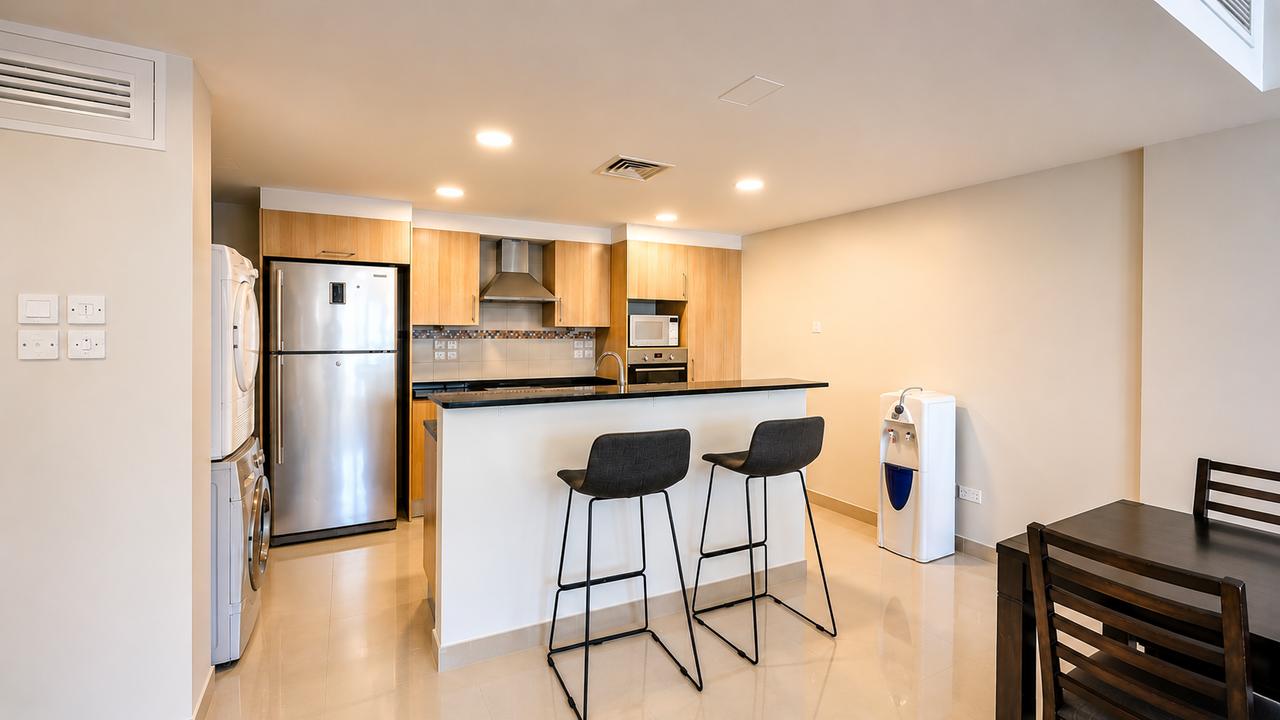 Two-Bedroom Apartment with Private Garden and Pool