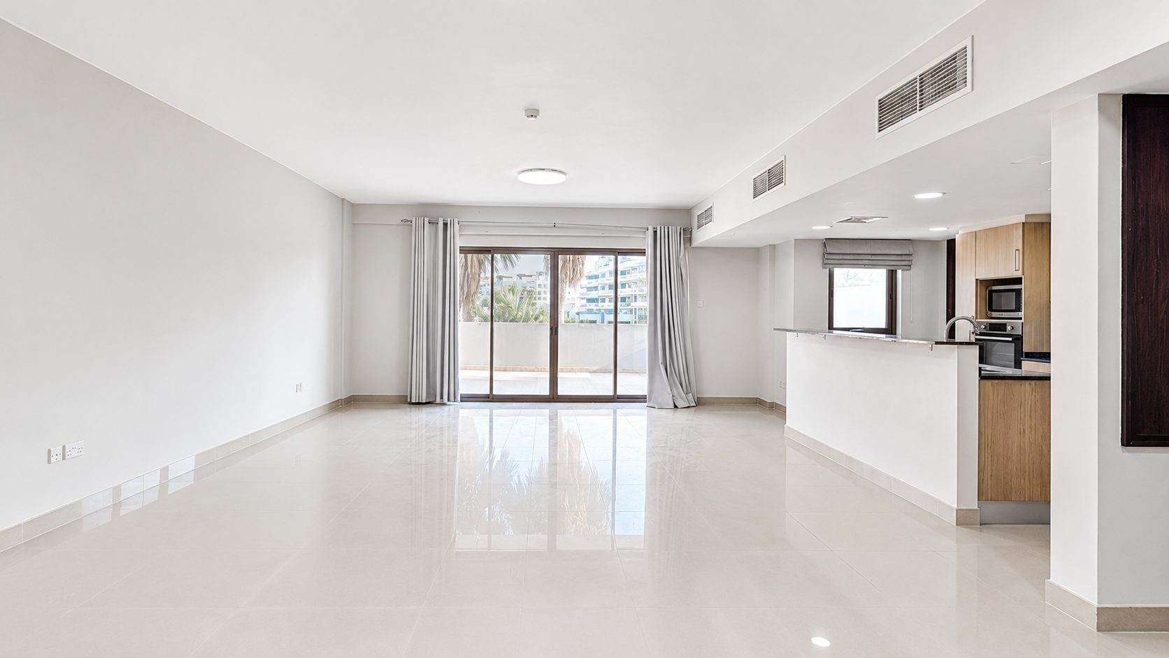 Three-Bedroom Apartment with Private Garden and Pool