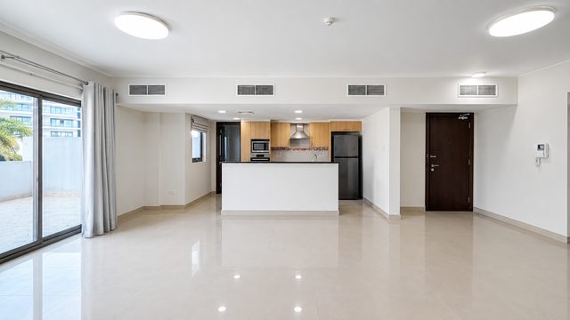 Three-Bedroom Apartment with Private Garden and Pool